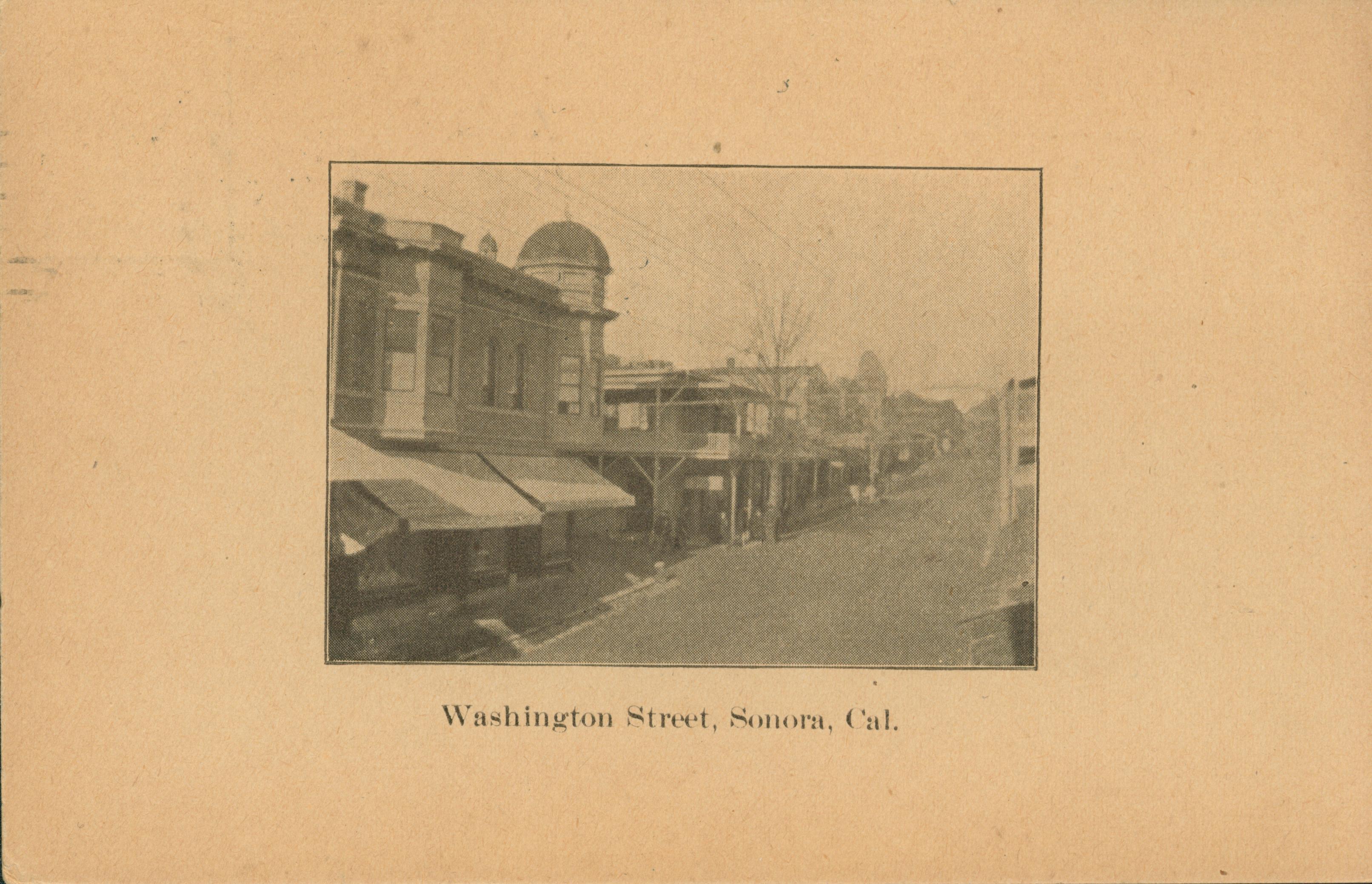 Shows Washington Street in Sonora lined with buildings